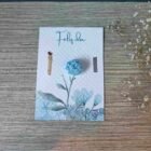 tarjeta y vela en forma de rosa